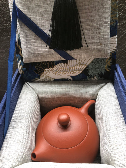 dark-red enameled pottery teapot